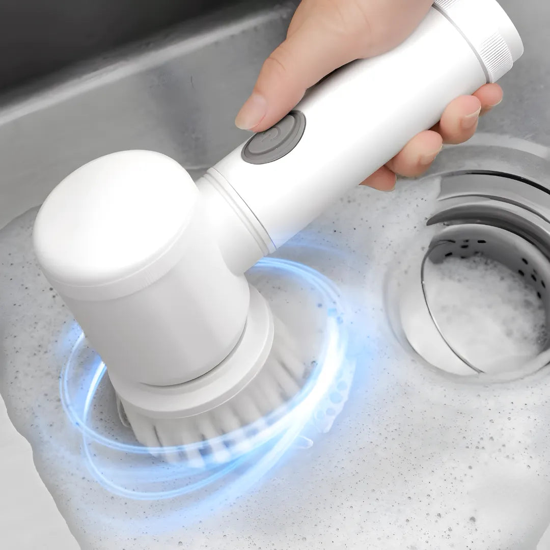 Image shows the electric spin scrubber actively cleaning a kitchen sink, creating rich foam. The powerful rotation removes grime quickly, making it a helpful tool for efficient household cleaning.