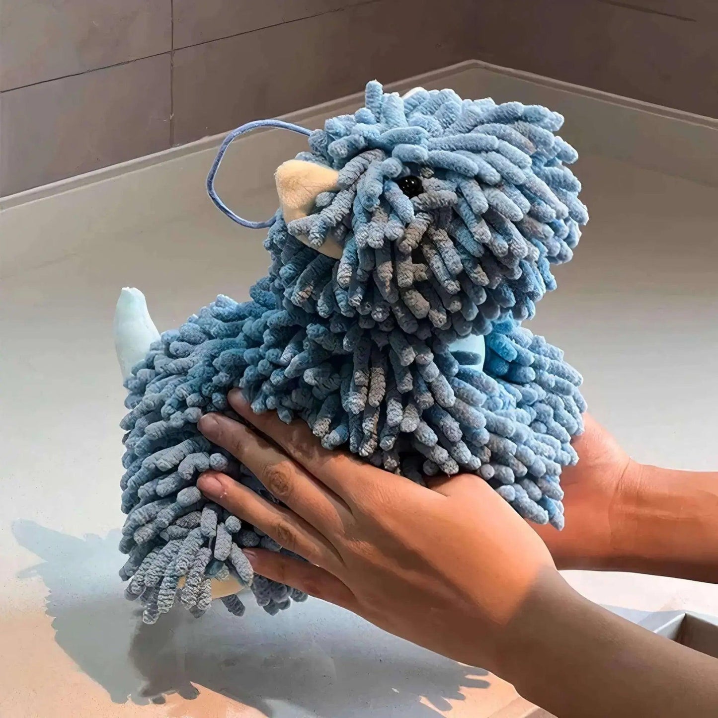 Blue chenille dog-shaped hand towel, soft and silky to the touch with a plush, adorable design
