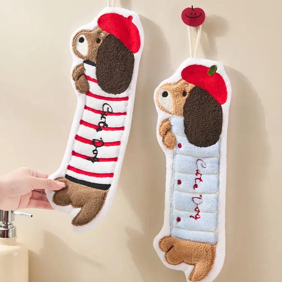 Striped dachshund-shaped towel in red and blue with loop for easy hanging and drying on wall