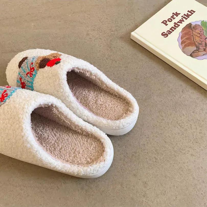 A pair of lightweight, easy-to-wear white memory foam house shoes with a soft interior lining and cute striped dachshund embroidery, placed on a beige floor.