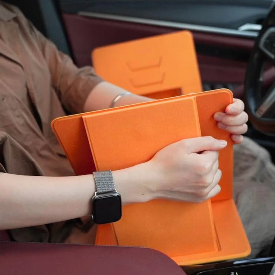 A person is folding the lap desk with ease, demonstrating its simple operation and flexible, portable structure that makes storing quick and effortless.