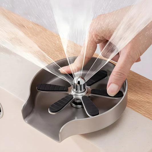 Image of a stainless steel glass rinser spraying high-pressure water from 9 holes, effectively cleaning the inside of a cup with powerful, multi-angle jets.