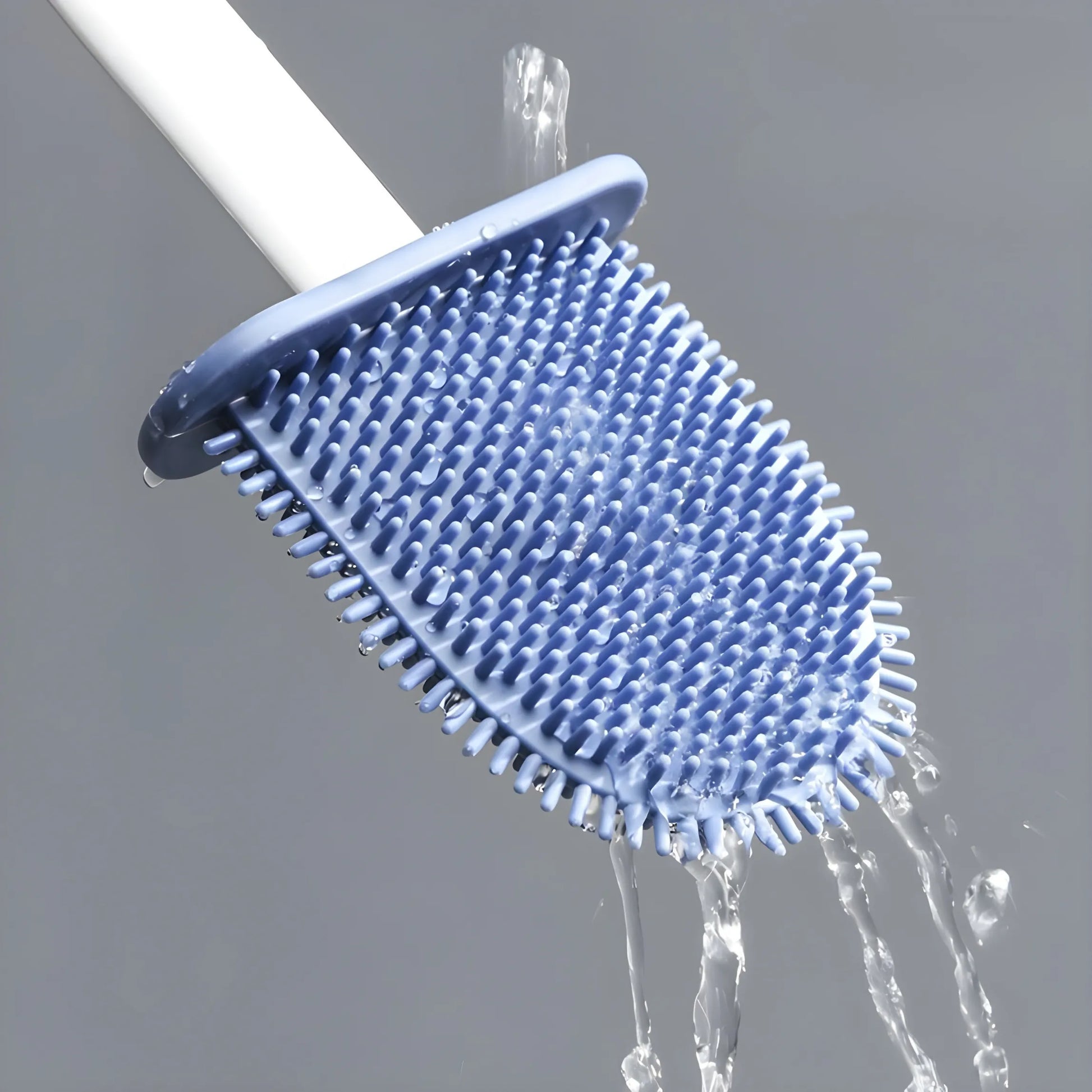 Close-up of a silicone toilet brush head being rinsed with clean water, with water flowing through the bristles to remove residue and prevent odors.