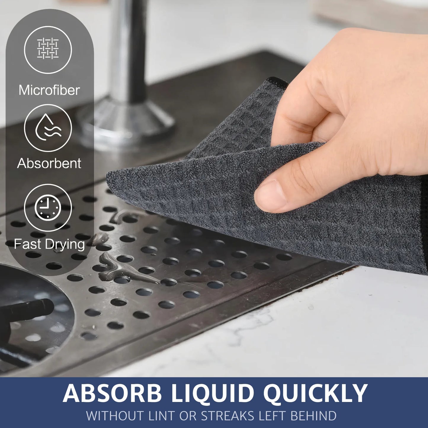 A person is using a waffle pattern microfiber cloth to wipe water stains off a coffee machine. The cloth absorbs quickly, leaving the surface lint-free and without streaks.