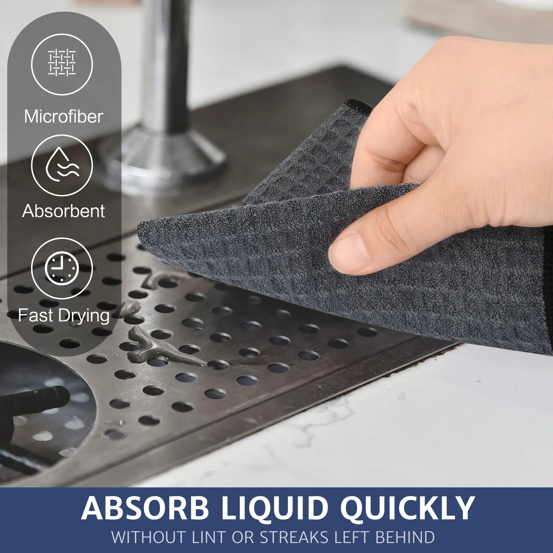 A person is using a waffle pattern microfiber cloth to wipe water stains off a coffee machine. The cloth absorbs quickly, leaving the surface lint-free and without streaks.