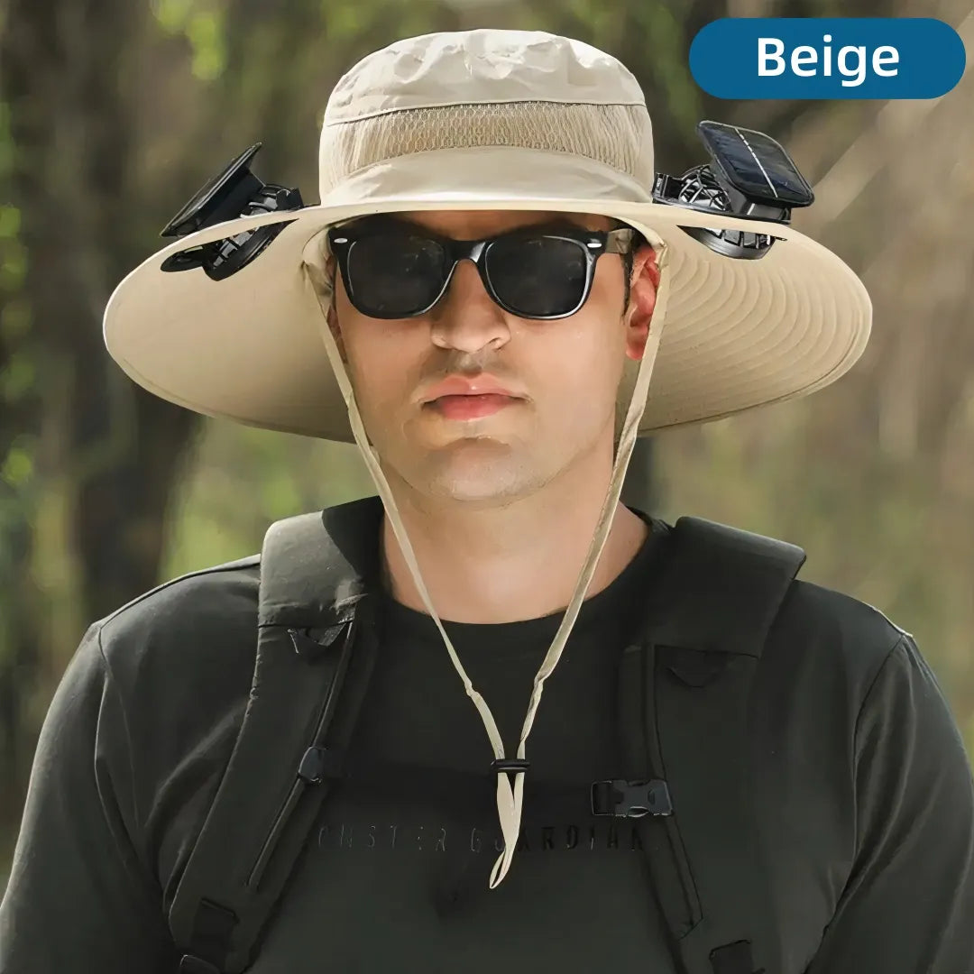 Person wearing a beige wide-brimmed hat and sunglasses with a blurred natural background
