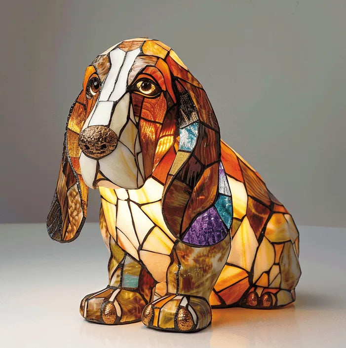 Stained glass dog-shaped lamp on a plain background