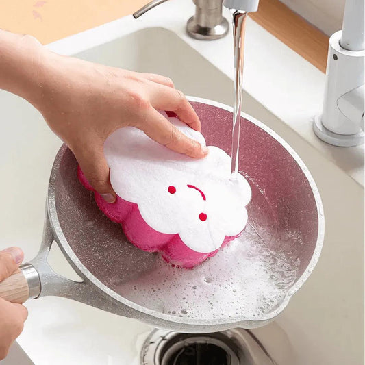 Cloud-shaped sponge lathers richly while scrubbing a greasy pan clean