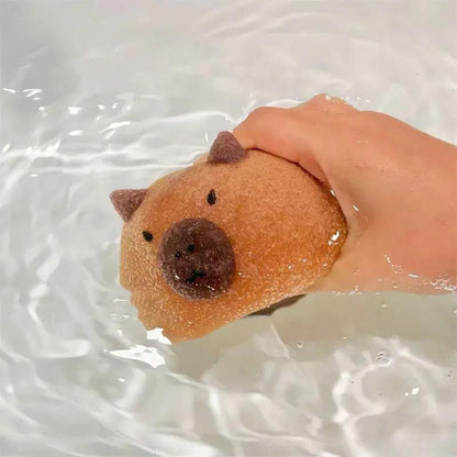 Super absorbent capybara-shaped sponge in light brown with dark brown ears and nose.