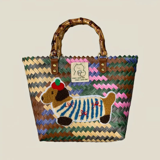 Handwoven dachshund tote bag with colorful durable woven patterns and bamboo handles, perfect for stylish women seeking a vintage and playful look.