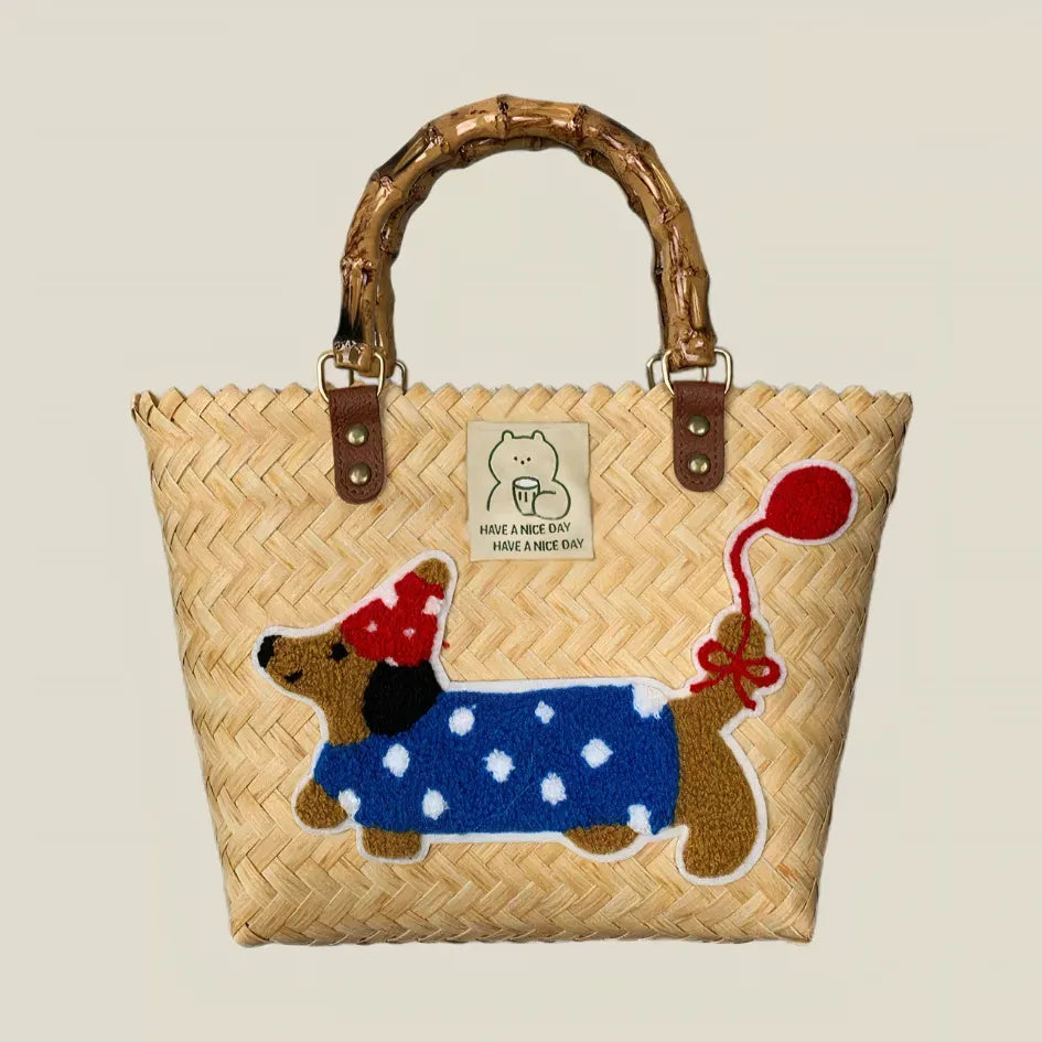 Handwoven dachshund tote bag featuring a dachshund in a cute polka dot hat with a balloon, bamboo handles, ideal for casual and retro daily outfits.
