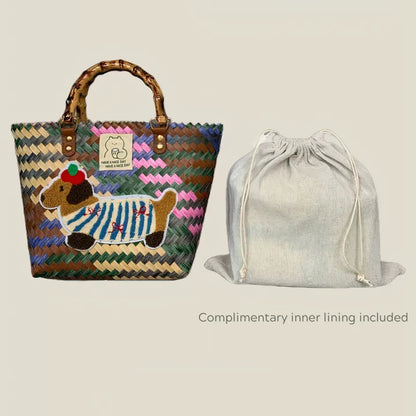 Handwoven dachshund tote bag with colorful woven design and bamboo handles, shown with complimentary drawstring linen inner lining for added convenience.