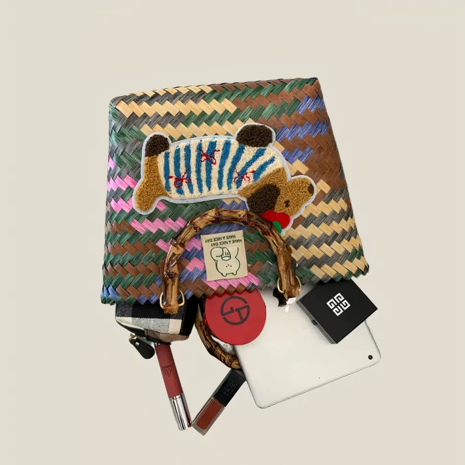 Handwoven dachshund tote bag with open-top design, showing its large capacity for daily essentials like cosmetics, wallet, and tablet.