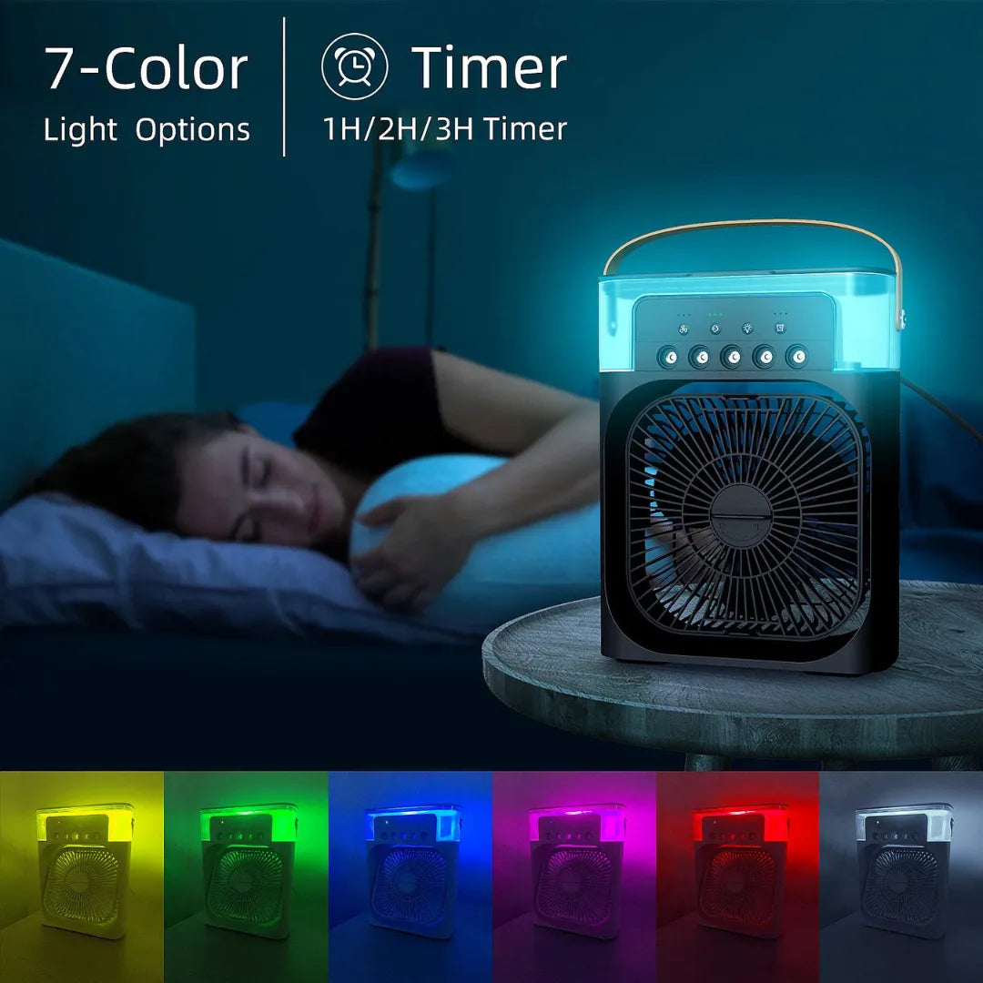 White portable air cooler emitting multicolor LED lights (yellow/green/blue/purple/red/white) with 1H/2H/3H timer display, placed beside sleeping person on bed.