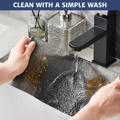 Microfiber cloth with visible dirt being rinsed under clean water, instantly removing stains and showing how easy it is to clean and maintain for long-lasting use.
