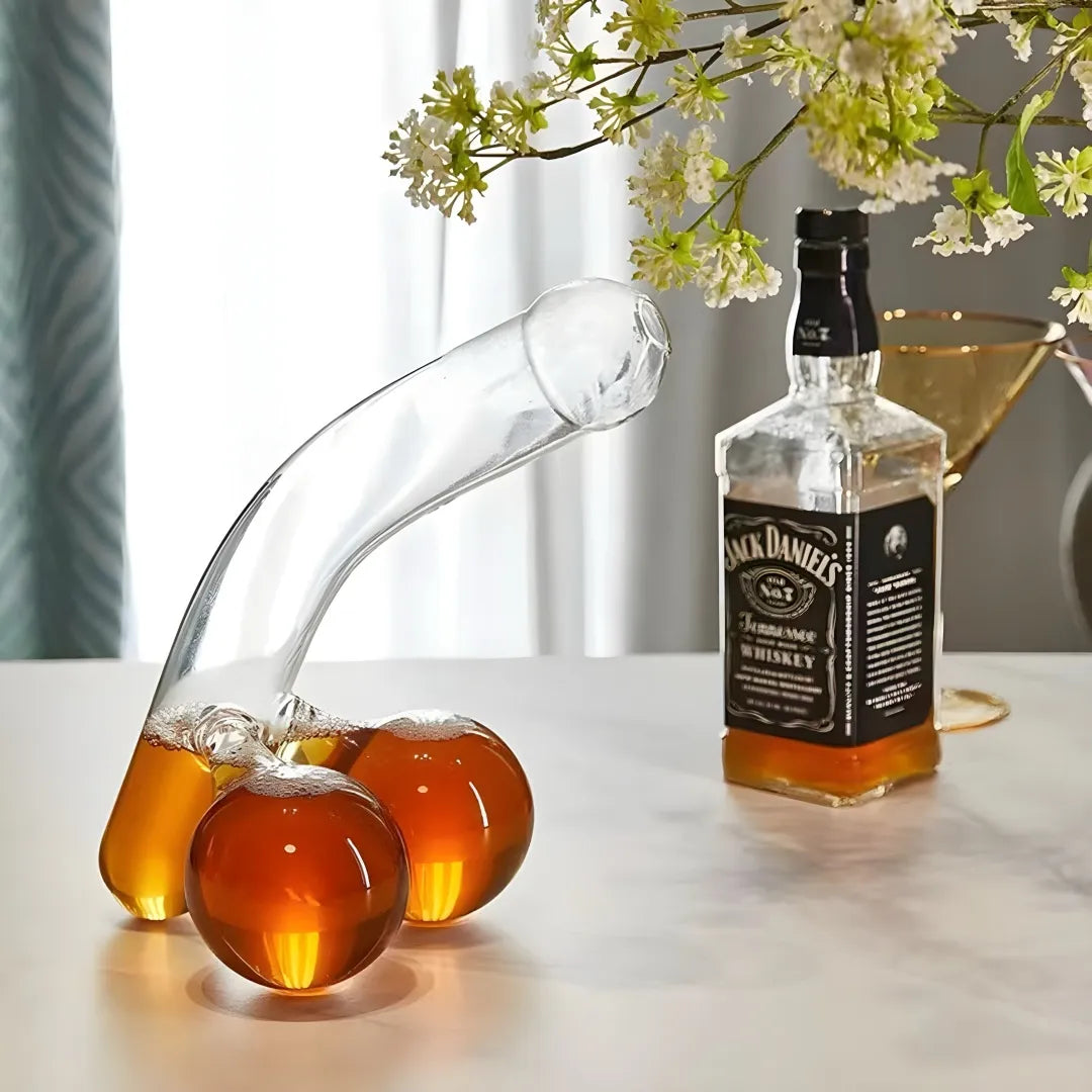 Jack Daniel's whiskey bottle with a glass decanter on a table.