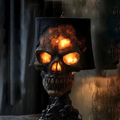 Halloween skull lava lamp with glowing orange eyes and cracked lava-filled shade, casting eerie light in dark horror-themed setting