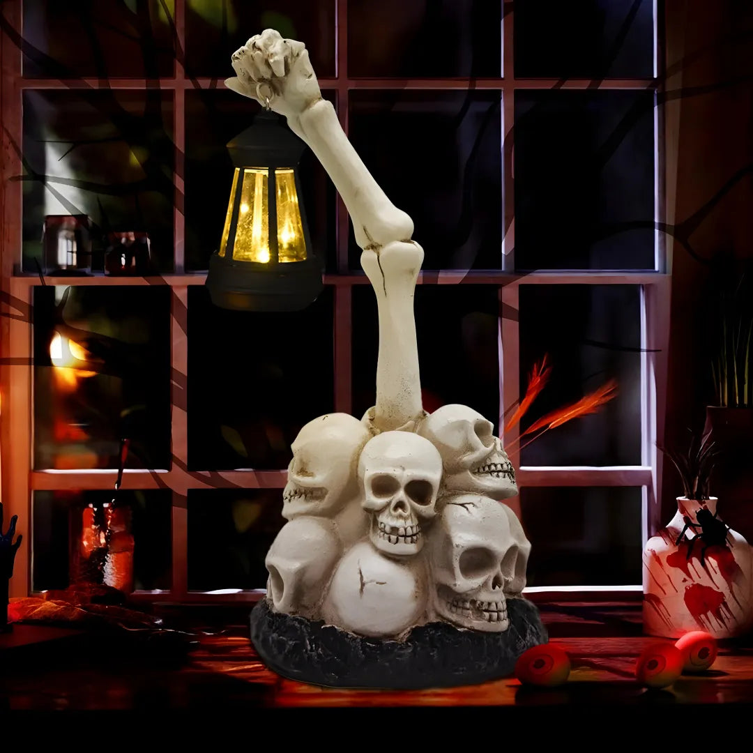 Skeletal hand holding a lantern with skulls below, set against a dark background.