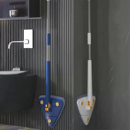 Blue and white long-handle triangle mops with yellow fasteners hanging on gray striped bathroom wall. Shows 360° swivel head design, space-saving storage, and modern cleaning tools next to black sink and metal accessories