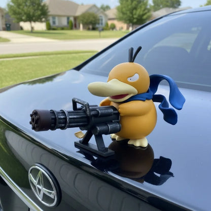 Psyduck car ornament with playful new look: yellow character in blue scarf aiming machine gun on black car hood against suburban neighborhood backdrop.