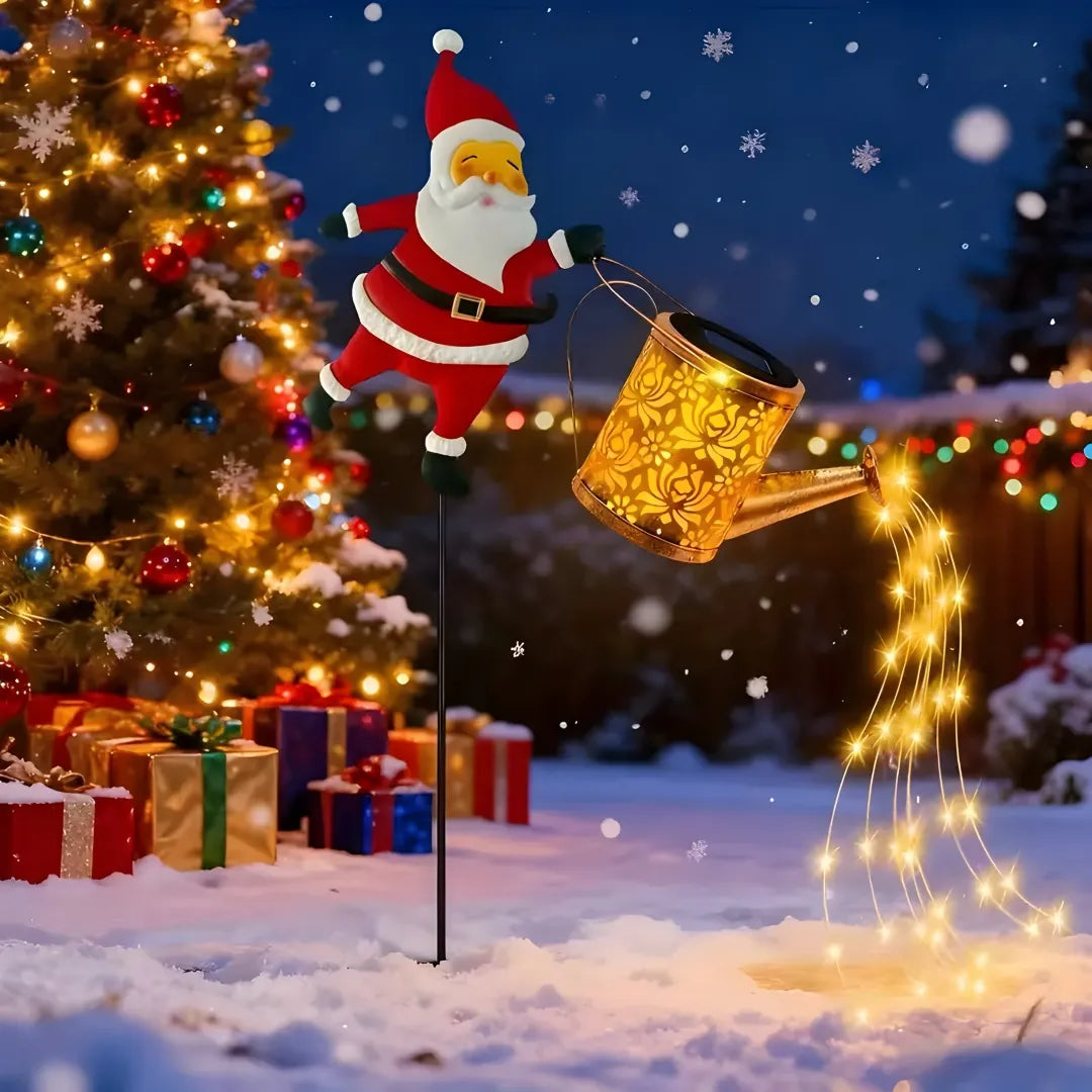 Durable construction Santa solar light with glowing watering can in snowy scene.