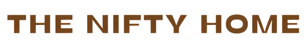 Logo of 'The Nifty Home' with brown text on a white background