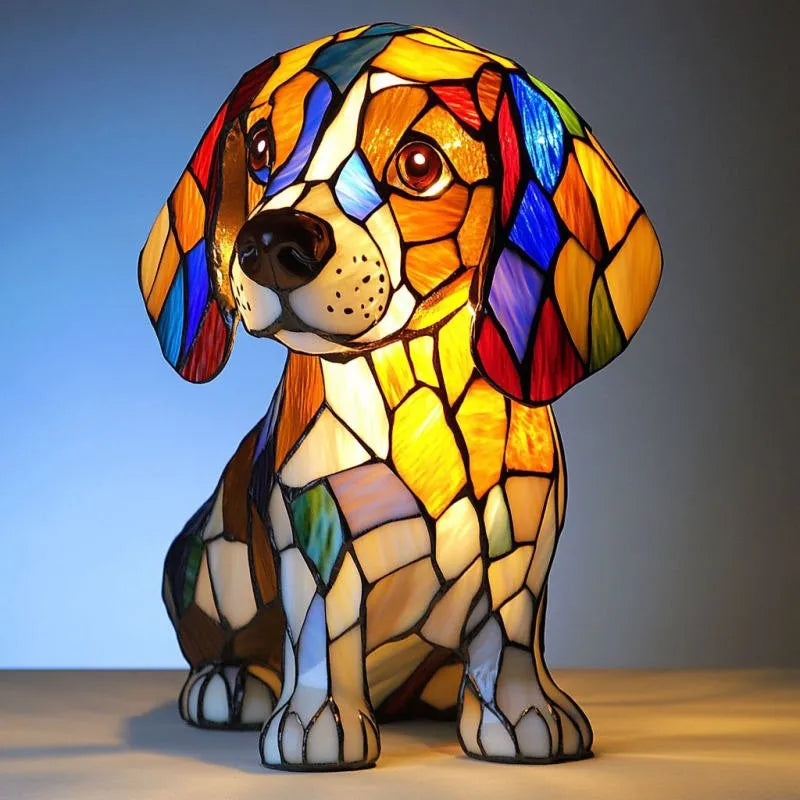 Colorful stained glass dog-shaped lamp on a wooden surface with a gradient background