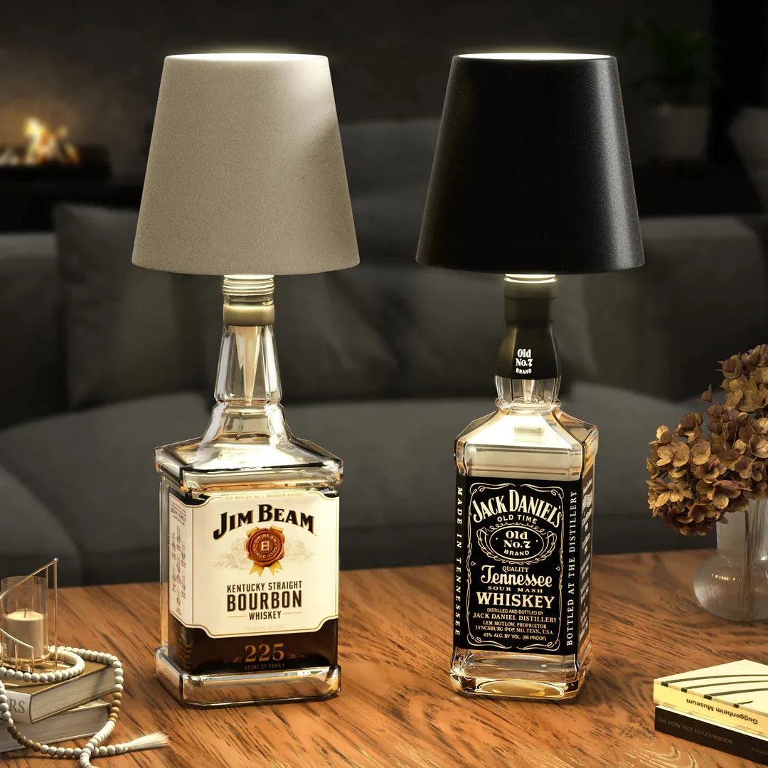 Wireless bottle lamp set featuring repurposed Jim Beam Kentucky Straight Bourbon and Jack Daniel's Tennessee Whiskey bottles with contrasting light and dark lampshades.