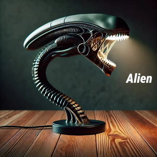 Xenomorph alien desk lamp with glowing open mouth and segmented neck. Dark sci-fi decor placed on wooden surface, perfect for collectors and gaming setups.